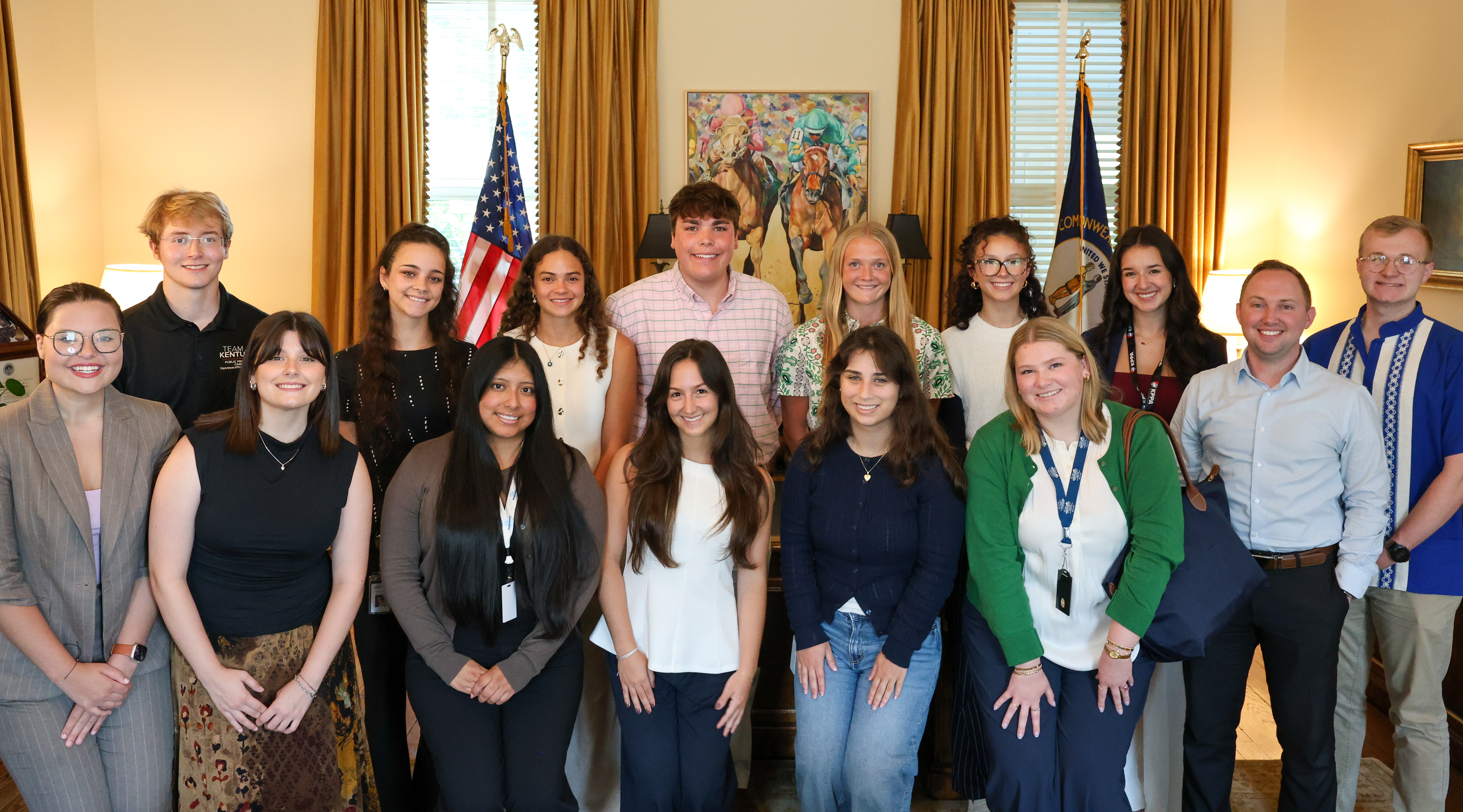 Interns gathered around the Governor's desk
